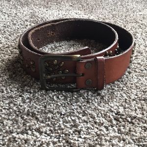 Tan belt with metal flower like accents